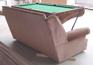 Illustration for article titled This Couch Turns Into a Snooker Table